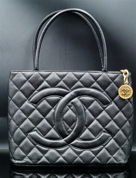 gold medallion black leather stitching chanel|CHANEL Caviar Quilted Medallion Tote Black .